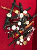 A BOX OF VARIOUS COSTUME WATCHES.