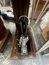 A CASED JONES SEWING MACHINE