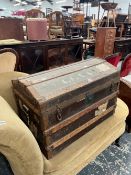 A VINTAGE CANVAS COVERED DOME TOP TRUNK WITH INTERIOR TRAY