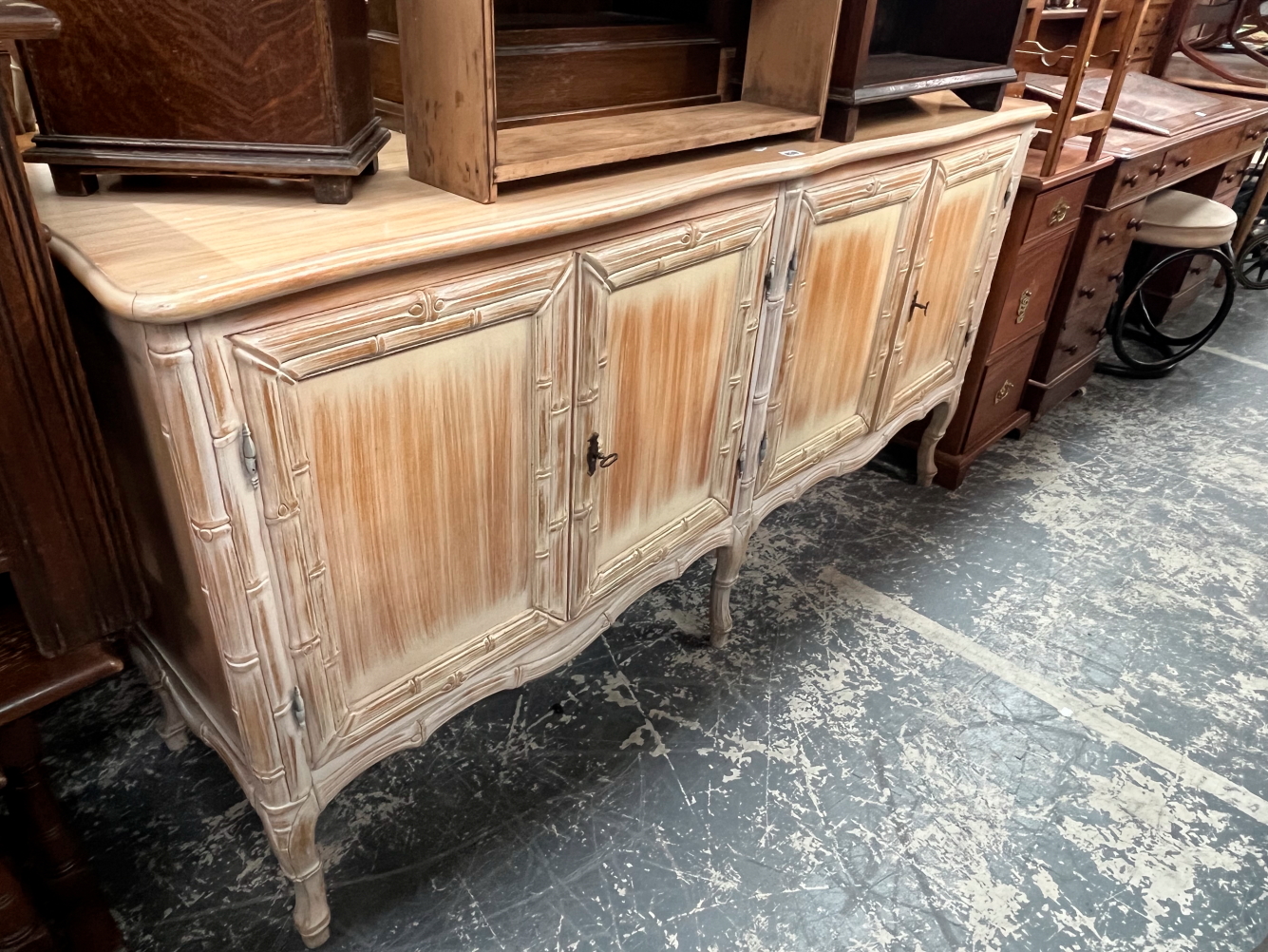 A 20th C. BLEACHED FAUX BAMBOO SIDE CABINET