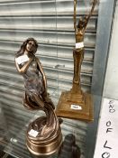 AN ART DECO STYLE BRONZE LADY STANDING WITH HANDS RAISED TOGETHER WITH A COLD CAST BRONZE FIGURE