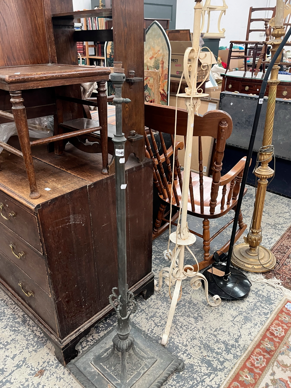 AN ANTIQUE BRASS ADJUSTABLE FLOOR STANDING LAMP BASE TOGETHER WITH A PAINTED EXAMPLE (2)