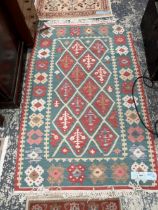 TWO SMALL ORIENTAL RUGS OF ZEIGLER DESIGN, TOGETHER WITH A TRIBAL KELIM RUG (3)