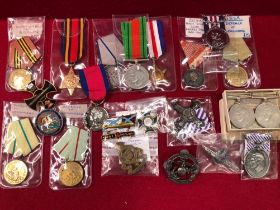 A COLLECTION OF VARIOUS MEDALS AND REPLICAS, AN ENAMELLED SILVER CROWN ETC.
