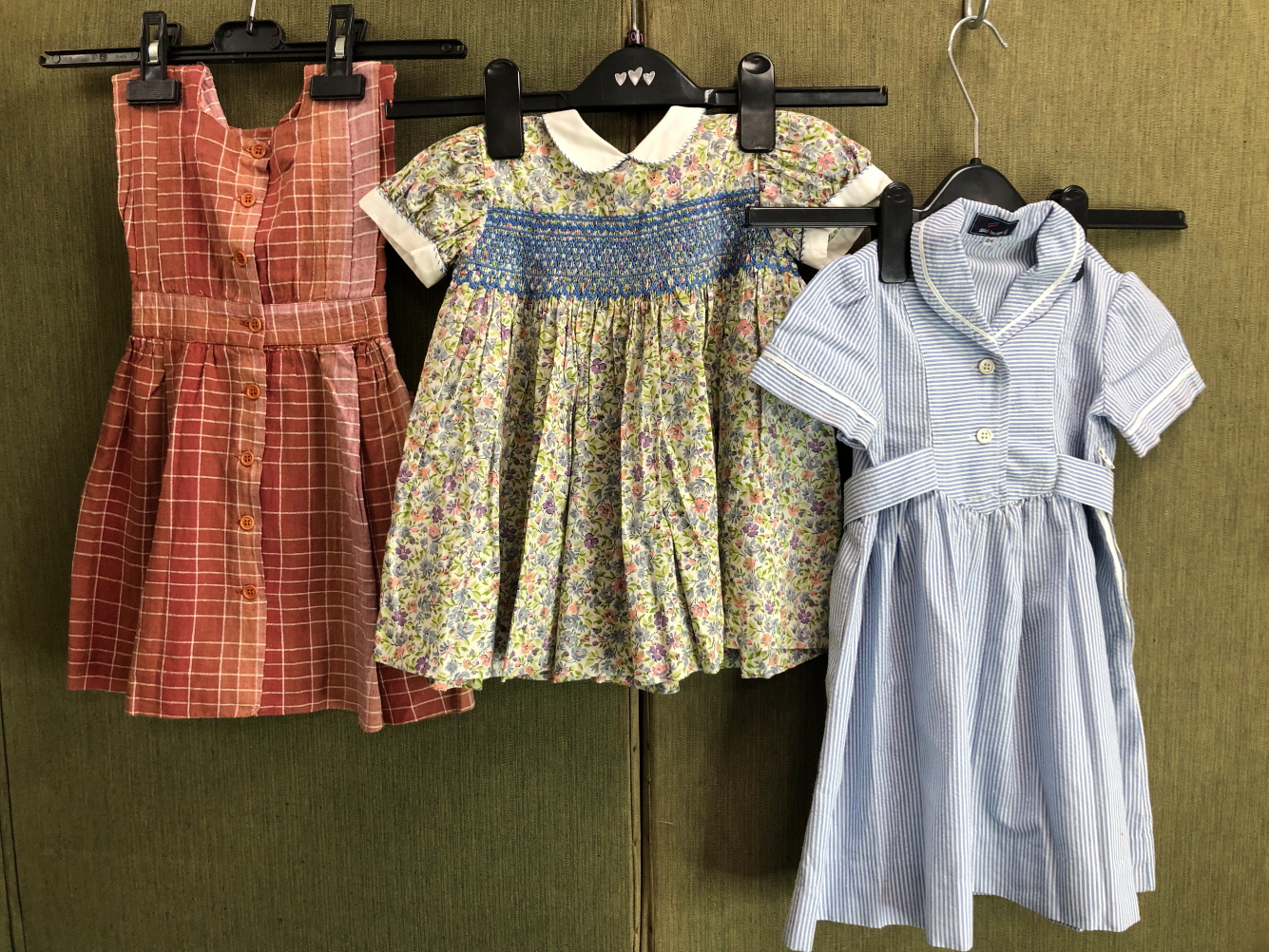 A LIBERTY OF LONDON SMOCKED CHILD'S DRESS, TOGETHER WITH TWO DANIEL HECHTER DRESSES (3)