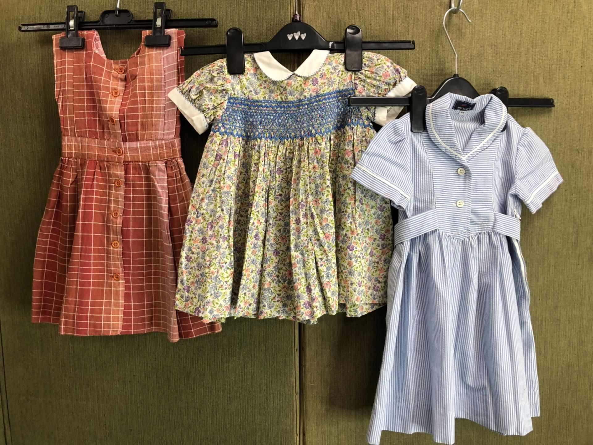 A LIBERTY OF LONDON SMOCKED CHILD'S DRESS, TOGETHER WITH TWO DANIEL HECHTER DRESSES (3)