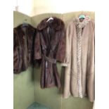 JACKET. A BROWN KESTILA TURKU FINLAND LEATHER FULL LENGTH COAT SIZE 12 WITH FAUX FUR LINING,