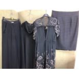 A PAIR OF WIDE LEGGED BLACK TROUSERS BY MARIO BORSATO COUTURE SIZE 44 AND A BLACK MARIO BORSATO