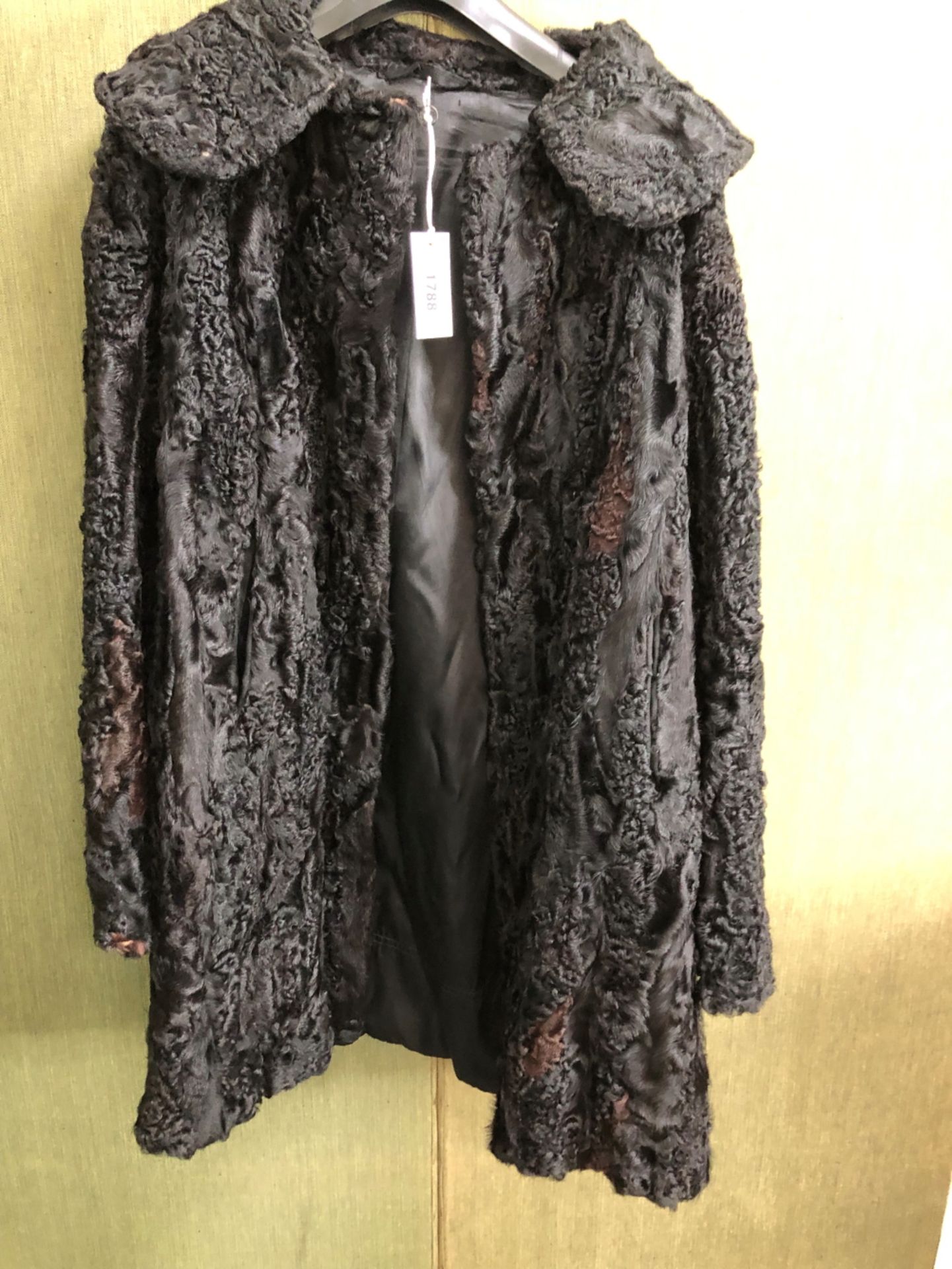 JACKET. LADYS HALF LENGTH COAT OR JACKET: BLACK ASTRAKHAN, ARMPIT TO ARMPIT 51, NECK TO HEM 93cms.