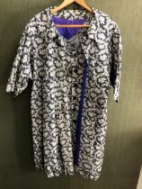 COAT AND SLEEVELESS DRESS, BLACK AND WHITE FLORAL DIAPER, THE COAT WITH A BLUE SILK LINING, NECK