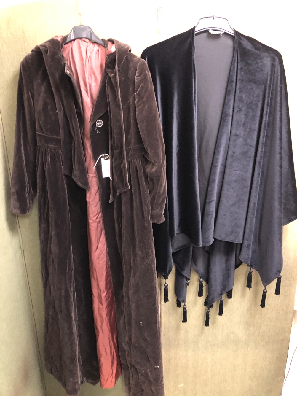 A FRANK USHER VELVET CAPE WITH TASSEL TRIM AND A MONO MADE IN ENGLAND BROWN VELVET HOODED LONG