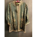 JACKET, AN INDIAN GREEN SILK JACKET EMBROIDERED IN GOLD THREAD, SLEEVE LENGTH 48cms, NECK TO HEM