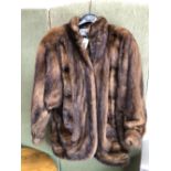 A PHILIP HOCKLEY MAYFAIR BROWN FUR JACKET. PIT TO PIT 52cm, SHOULDER TO HEM 83cm SHOULDER TO CUFF