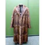 COAT. GRIFFIN & SPALDING, FURRIERS, NOTTINGHAM SHOULDER TO CUFF 61 cm. SHOULDER TO HEM 116cm.PIT