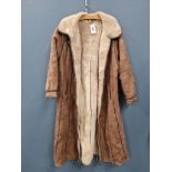 COAT. A FULL LENGTH LAMB SKIN JACKET, MADE IN TURKEY WITH A TAG SIZE 12, PIT TO PIT 54cms,