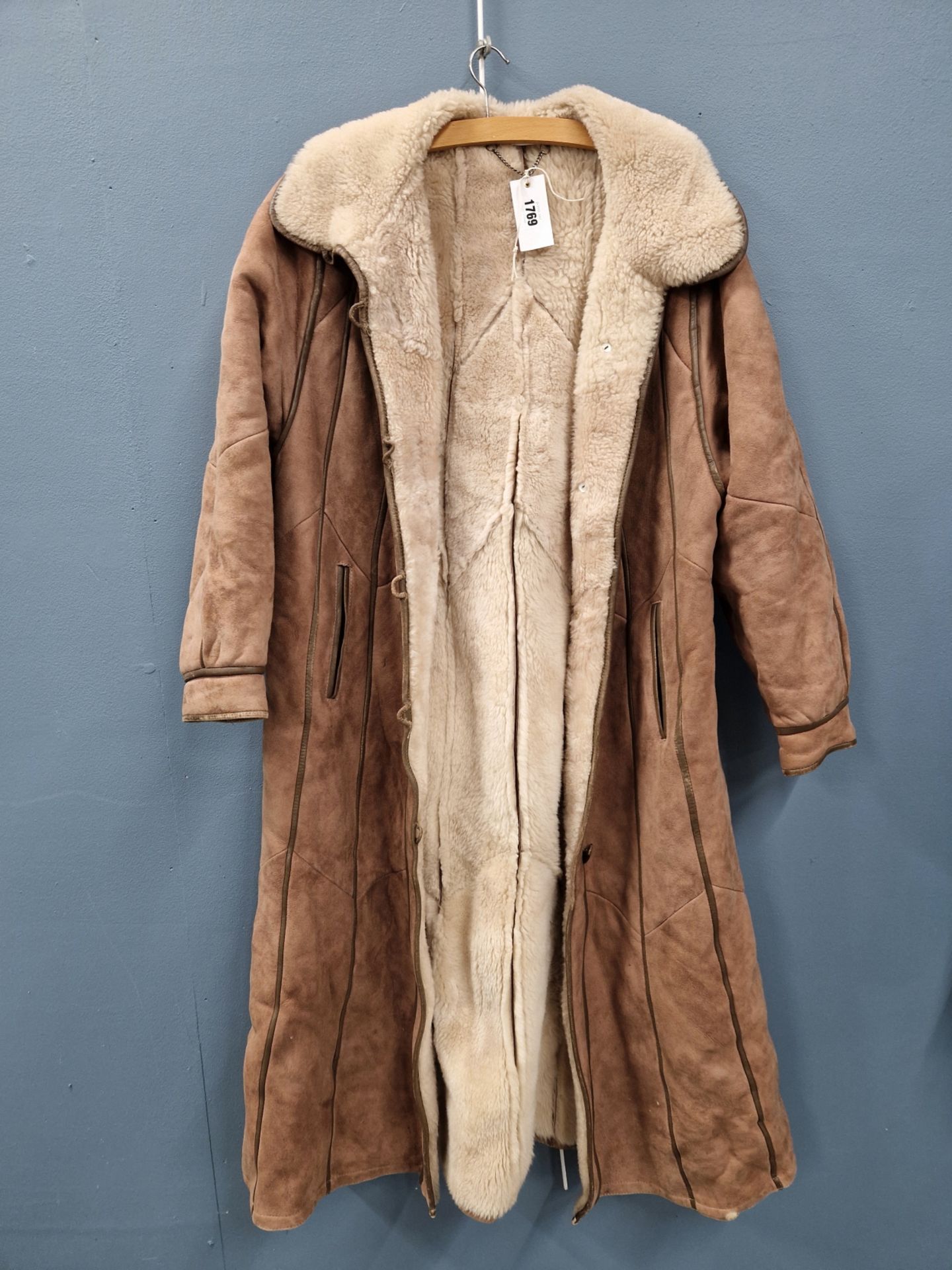 COAT. A FULL LENGTH LAMB SKIN JACKET, MADE IN TURKEY WITH A TAG SIZE 12, PIT TO PIT 54cms,