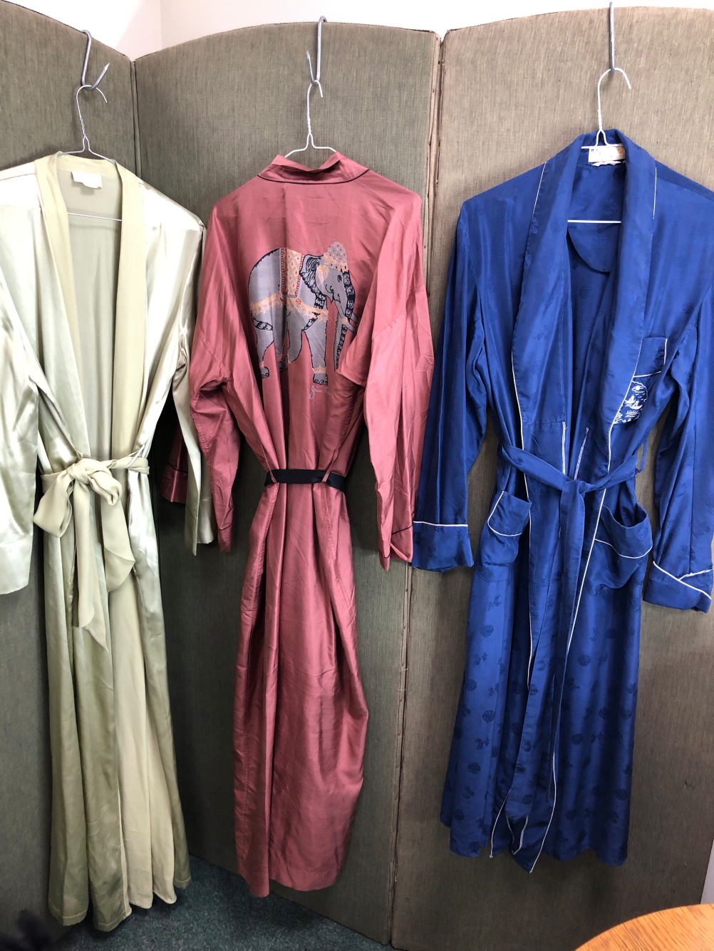 THREE SILK DRESSING GOWNS, TO INCLUDE A NAVY HEALTH EXAMPLE WITH BLUE PATTERN,A GREEN MOALIJIA