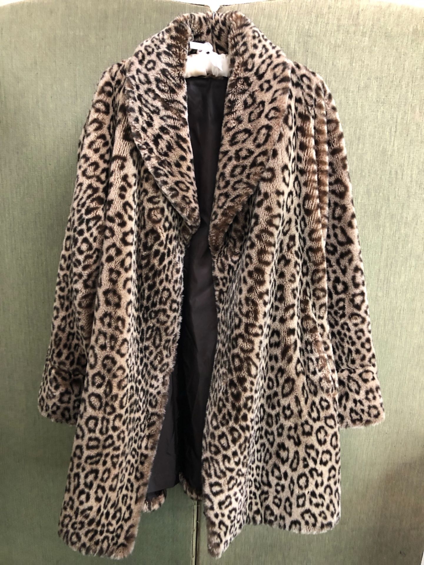 COAT: A NUAGE ANIMAL PRINT FAUX FUR COAT.