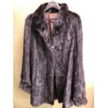 A BLACK FUR LADIES COAT SHOULDER TO CUFF 72cm, SHOULDER TO HEM 89cm PIT TO PIT 66cm.