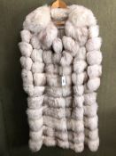FUR COAT: EMILIO GUCCI, WHITE WITH HORIZONTAL GREY TINGED BANDS, WITH ZIPPED BAND TO ADJUST THE