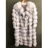 FUR COAT: EMILIO GUCCI, WHITE WITH HORIZONTAL GREY TINGED BANDS, WITH ZIPPED BAND TO ADJUST THE