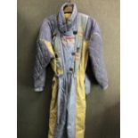 SKI SUIT. LEMMEN JOKI ENCHANTING TALES OF WILD NORTH GREY AND PALE MUSTARD SKI SUIT SIZE GB 10