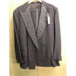 A DOUBLE BREASTED DINNER JACKET: BLACK SILK TRIMMED, CHEST 40, WAIST 40