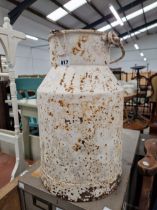 A WHITE PAINTED IRON MILK CHURN