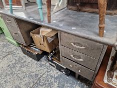 A GREY METAL KNEEHOLE DESK, THE PEDESTALS EACH WITH THREE DRAWERS