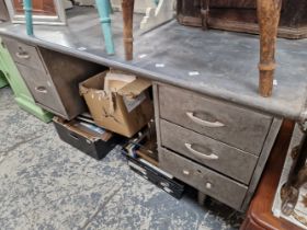 A GREY METAL KNEEHOLE DESK, THE PEDESTALS EACH WITH THREE DRAWERS