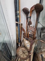 A BAG OF HICKORY STEMMED AND OTHER GOLF CLUBS TOGETHER WITH FISHING RODS AND A KEEP NET