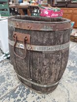 A TWO HANDLED COOPERED WOOD BARREL