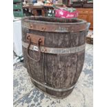 A TWO HANDLED COOPERED WOOD BARREL