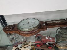 AN OAK CASED ANEROID BANJO BAROMETER WITH A MERCURY THERMOMETER