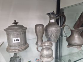 PEWTER, TO INCLUDE TWO JUGS, A VASE, A BISCUIT BARREL AND A SPIRIT MEASURE