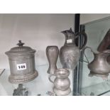 PEWTER, TO INCLUDE TWO JUGS, A VASE, A BISCUIT BARREL AND A SPIRIT MEASURE