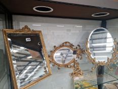 THREE VARIOUS MIRRORS TOGETHER WITH A GILT PUTTO FIGURAL TABLE LAMP
