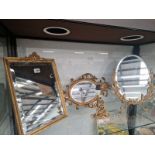 THREE VARIOUS MIRRORS TOGETHER WITH A GILT PUTTO FIGURAL TABLE LAMP