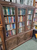 A LARGE GLAZED BOOK CASE SIDE CABINET Height 178cms Width 153cms Depth 34cms