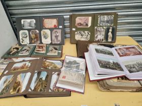 NINE ALBUMS AND SOME SHEETS OF POSTCARDS AND PHOTOGRAPHS