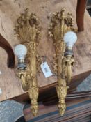 A PAIR OF ORMOLU WALL LIGHTS WITH BERIBBONED QUIVER BACK PLATES