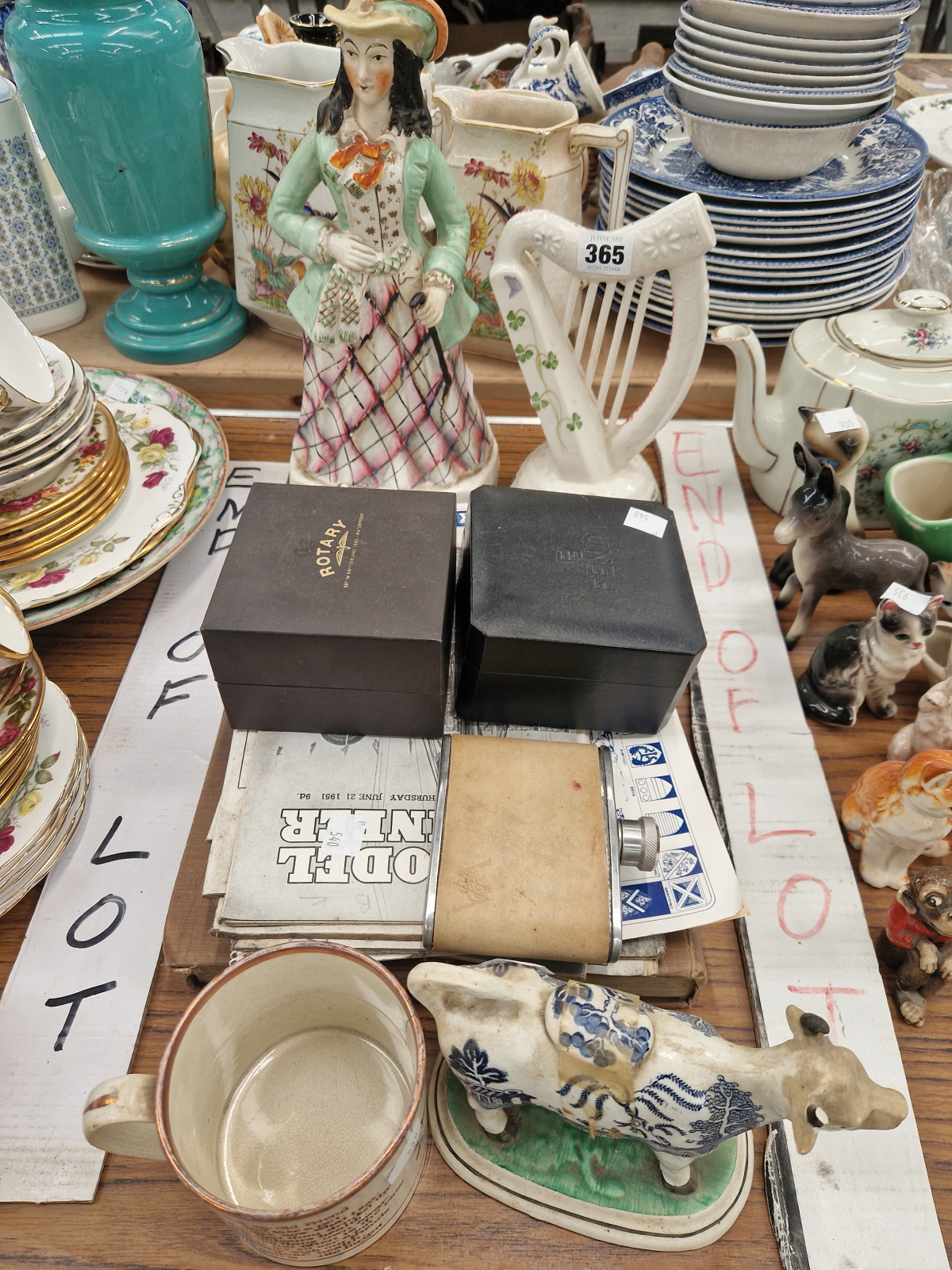 A CARLTON WARE GUINNESS HARP, A STAFFORDSHIRE LADY, A COW CREAMER, TWO WRISTWATCHES AND VARIOUS