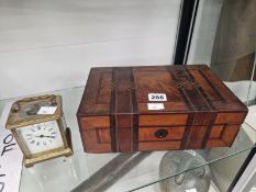 A CARRIAGE TIMEPIECE TOGETHER WITH A GEOMETRICALLY PARQUETRIED BOX