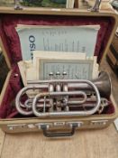A BOOSEY AND HAWKES TRUMPET, CASE AND SOME SHEET MUSIC