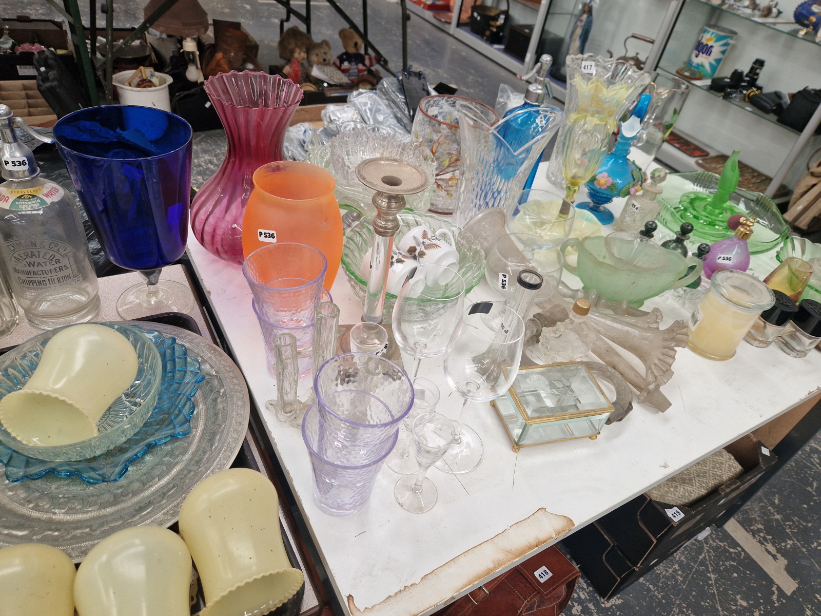 GLASS VASES, BOWLS AND A SET OF FOUR YELLOW GLASS LIGHT SHADES, 3 SODA SIPHONS, SCENT BOTTLES, ETC.