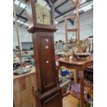A 20th C. MAHOGANY CASED GRANDMOTHER CLOCK TOGETHER WITH A MAHOGANY TWO TIER SIDE TABLE