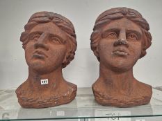 A PAIR OF RUST COLOURED HEAD FORM PLANTERS