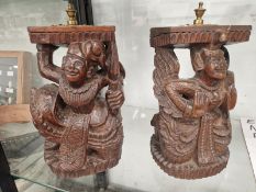 A PAIR OF CRAVED WOOD MALAYSIAN FIGURES