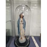 A POLYCHROME FIGURE OF THE MADONNA UNDER A GLASS DOME