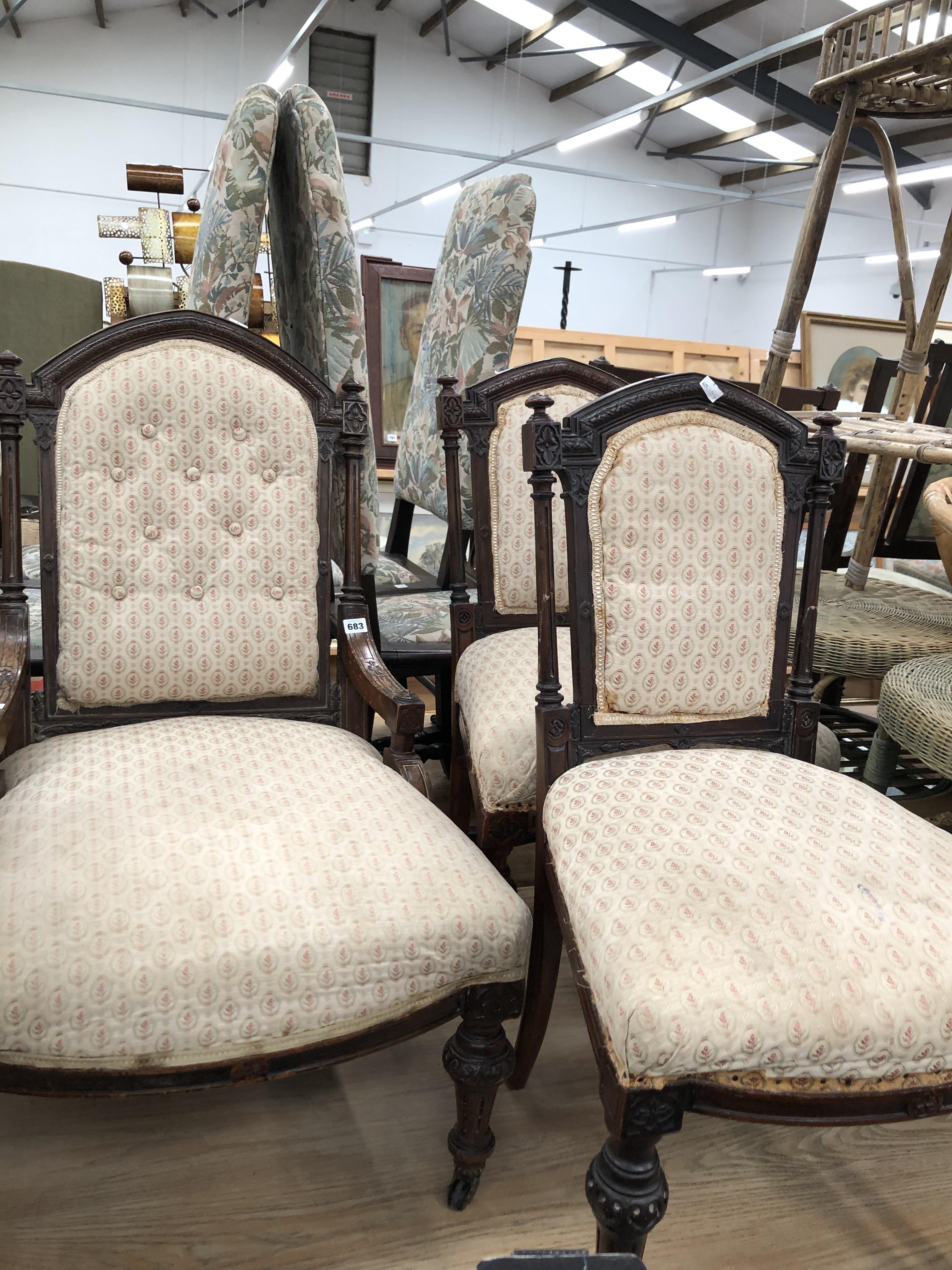 A VICTORIAN MAHOGANY ARM CHAIR EN SUITE WITH A PAIR OF SIDE CHAIRS